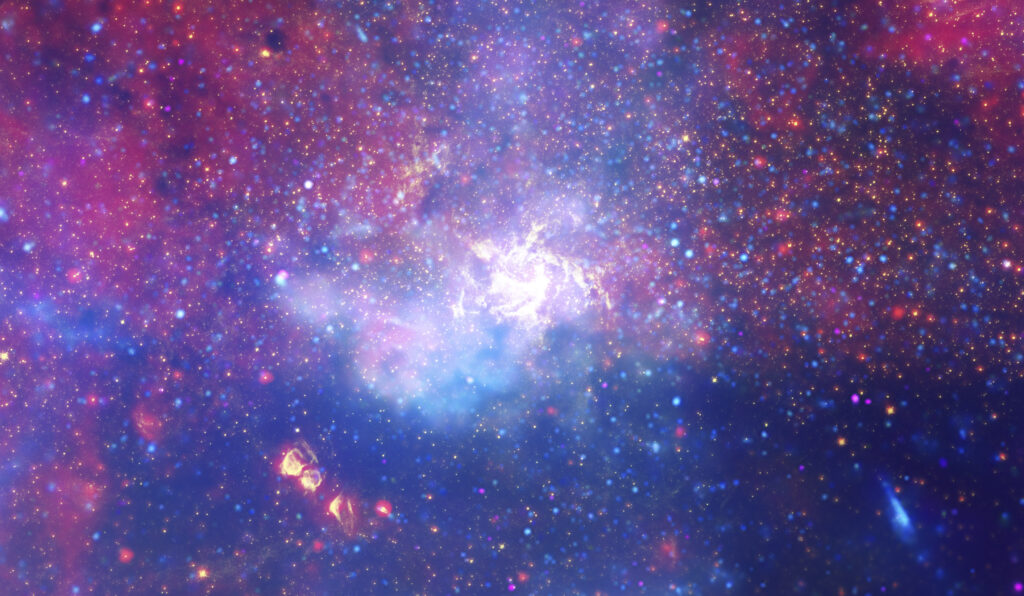 Un enorme vortice vorticoso di gas caldo risplende di luce infrarossa, segnando la posizione approssimativa del buco nero supermassiccio nel cuore della nostra galassia, la Via Lattea