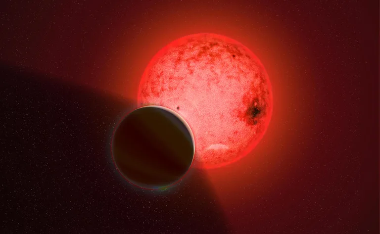 Rappresentazione artistica di un gigante gassoso in orbita attorno a una piccola stella nana rossa chiamata TOI-5205